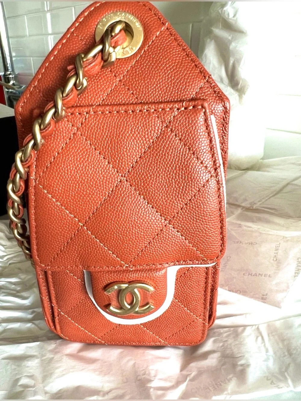 CHANEL Orange Quilted Drawstring Shoulder Bag with Gold Chain